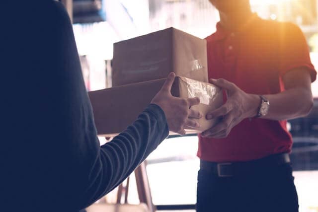 Courier handing over a package